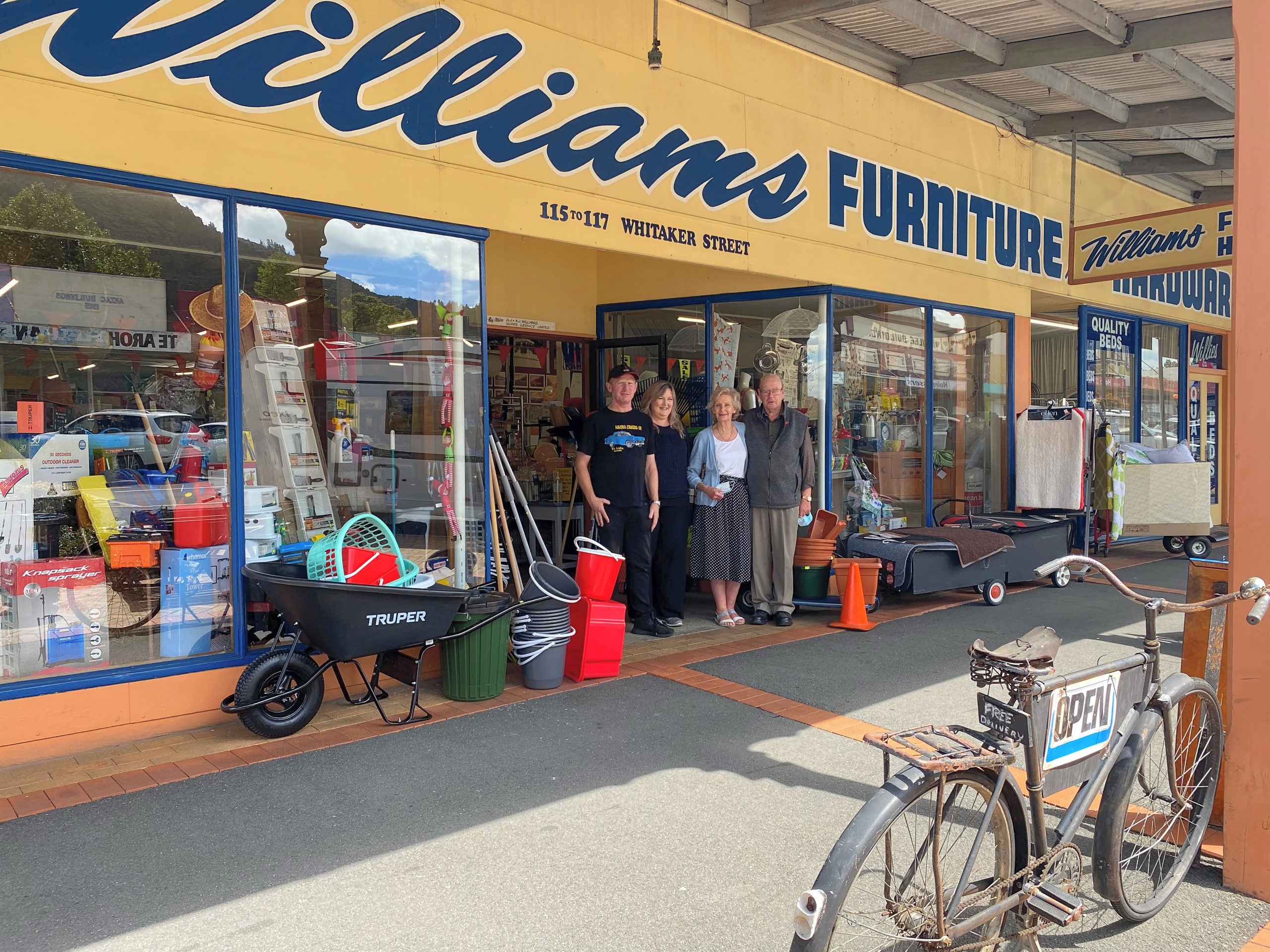 ABOVE: A change at the helm for Williams Furniture and Hardware, with (from left) Andrew and Lisette Hight taking over from Andrina and Dennis Williams.